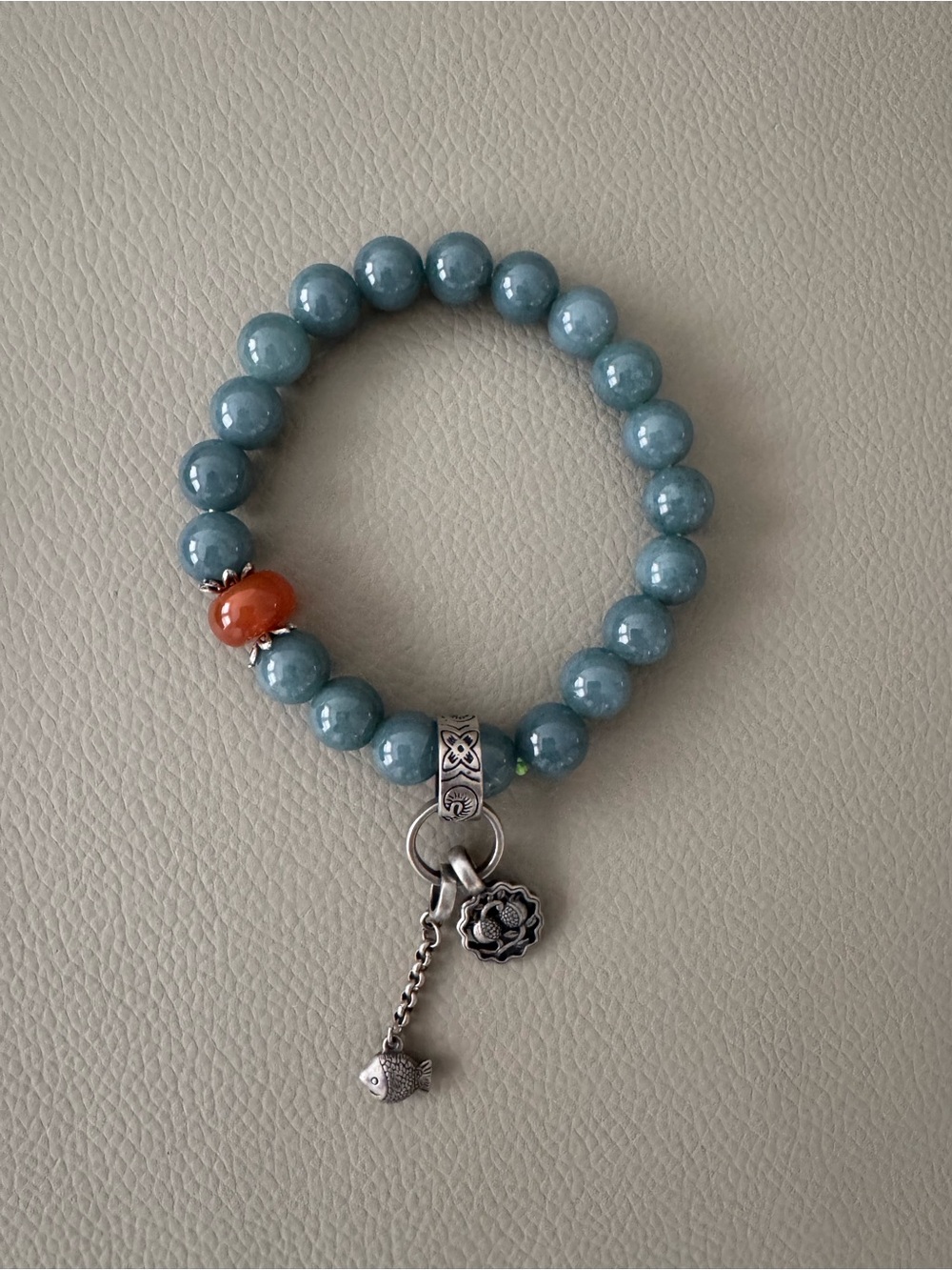 Blue Beaded Charm Bracelet with Orange Accent